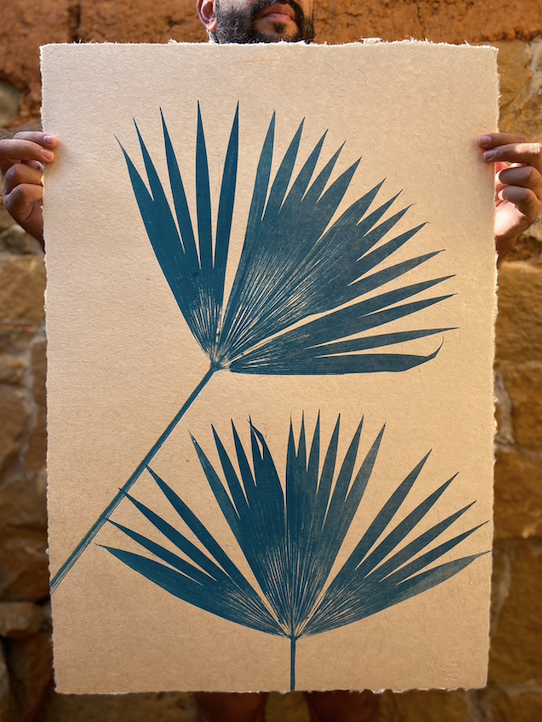 Botanical palm print in blue made from natural fiber paper.
