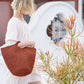 Woven basket bag on woman's arm 