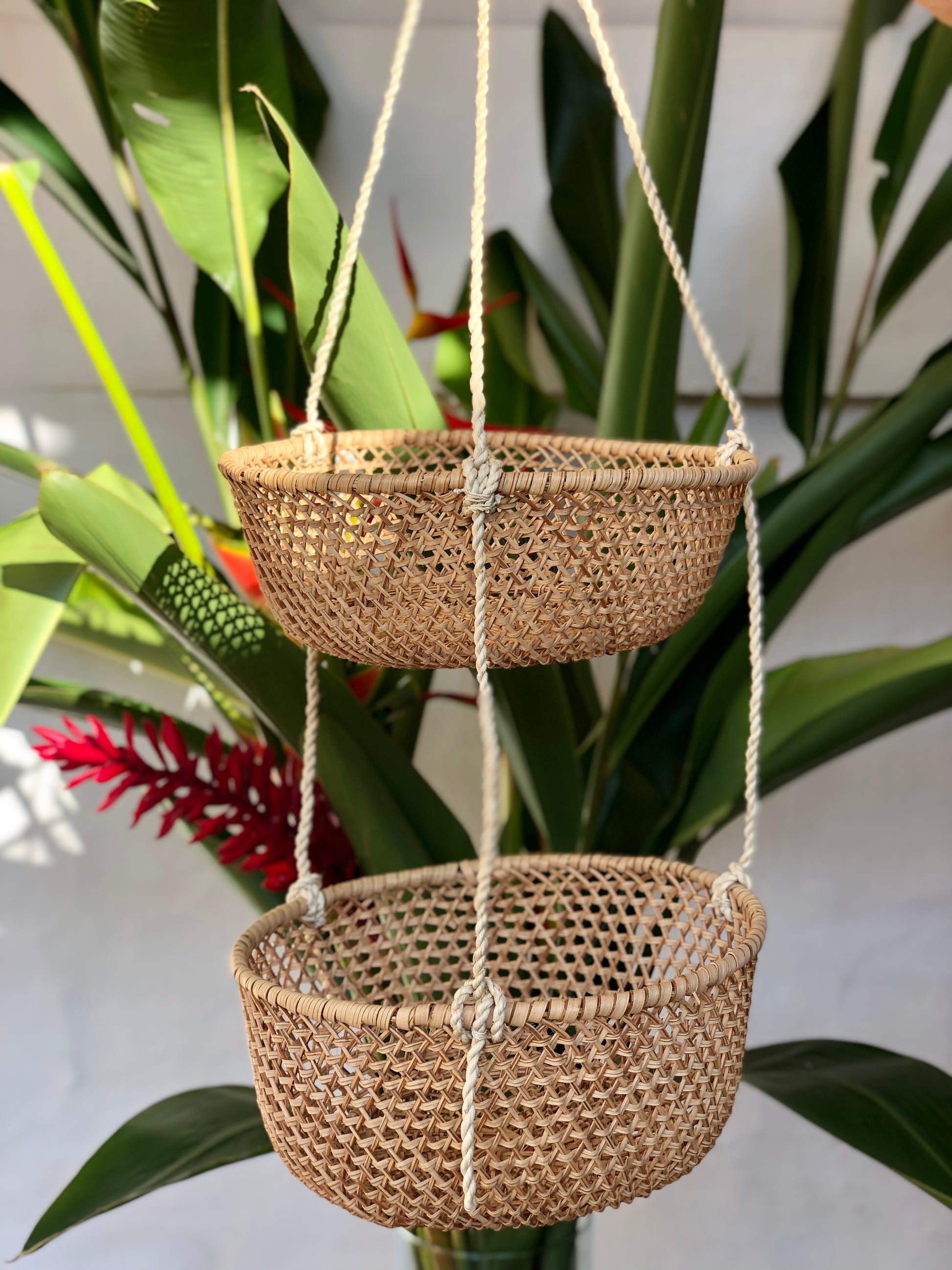 Hanging handwoven two tiered basket.