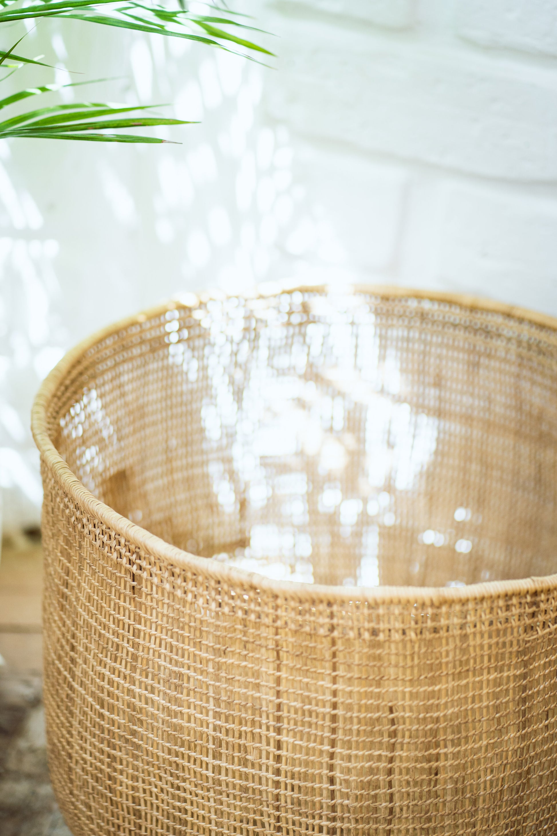 Natural fiber handwoven basket in soft light